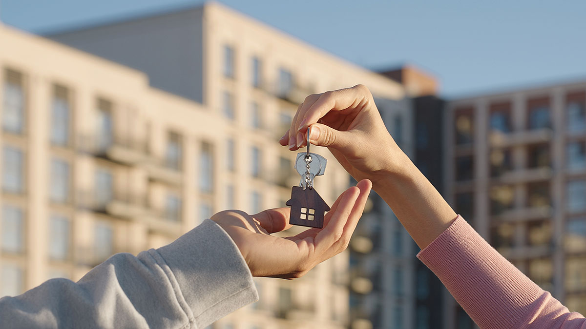 person handing over set of keys